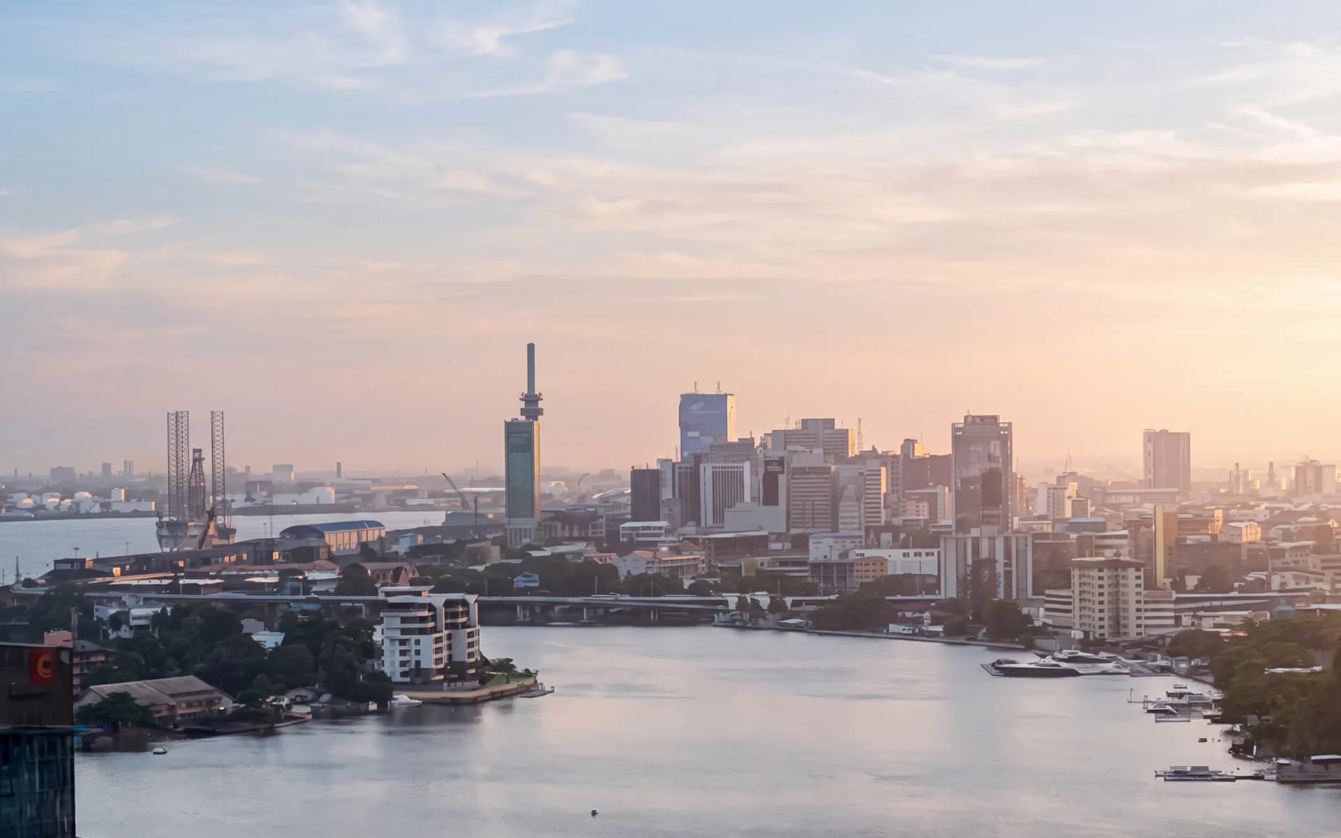 Lagos Island skyline across the lagoon at sunset, photographed from the waterfront.